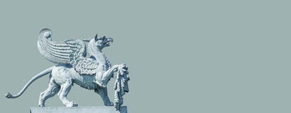 Banner With An Old Statue Of Medieval Griffin, A Hybrid Of Lion And Bird, On The Top Of The State Opera House In Downtown Of Royalty Free Stock Photo Banner With An Old Statue Of Medieval Griffin, A Hybrid Of Lion And Bird, On The Top Of The State Opera House In Downtown Of Royalty Free Stock Photo