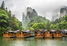 Baofeng Lake Boat Trip In A Rainy Day With Clouds And Mist At Wulingyuan, Zhangjiajie National Forest Park, Hunan Province, China, Stock Photography Baofeng Lake Boat Trip In A Rainy Day With Clouds And Mist At Wulingyuan, Zhangjiajie National Forest Park, Hunan Province, China, Stock Photography