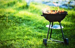 Barbecue grill with fire. On nature, outdoor, close up Barbecue grill with fire. On nature, outdoor, close up
