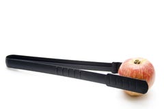 Barbecue Tongs With Red Apple Royalty Free Stock Photography