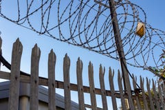 Barbed wire on blue sky background - Lost freedom and hope concept stock image Barbed wire on blue sky background - Lost freedom and hope concept stock image