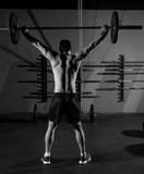 Barbell weight lifting man rear view workout gym stock photo Barbell weight lifting man rear view workout gym stock photo