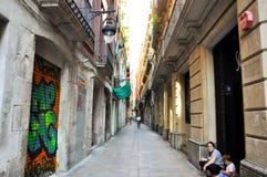 BARCELONA-AUGUST 13: Narrow street in the Gothic Quarter of Barcelona. The Gothic Quarter is the centre of the old city of Barcelo Stock Images BARCELONA-AUGUST 13: Narrow street in the Gothic Quarter of Barcelona. The Gothic Quarter is the centre of the old city of Barcelo Stock Images