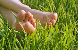 Bare feet in the grass