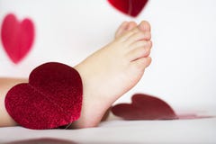 Bare feet among hearts royalty free stock images Bare feet among hearts royalty free stock images