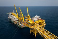 Barge installation platform in offshore oil and gas industry, Supply boat or barge support worker for work on offshore platform