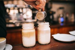 Barista making coffee drinks Barista making coffee drinks