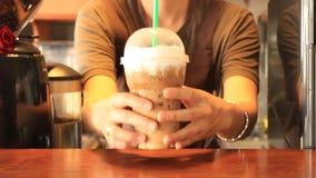 Barista Serving Plastic Glass av med is cappuccino stock video Barista Serving Plastic Glass av med is cappuccino stock video