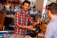 Bartender Serving Draught Beer In Bar Stock Images Bartender Serving Draught Beer In Bar Stock Images
