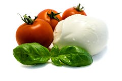 Basilico del pomodoro della mozzarella isolato su fondo bianco fotografia stock Basilico del pomodoro della mozzarella isolato su fondo bianco fotografia stock