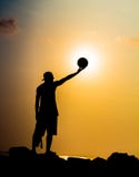 Basketball player at sunset stock photo Basketball player at sunset stock photo