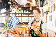 Bavarian woman drinking wheat beer stock image Bavarian woman drinking wheat beer stock image