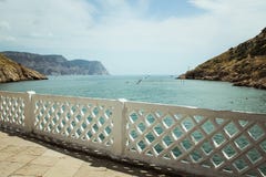The Bay of Balaklava and the Ruins of Genoese fortress Cembalo. Balaklava, Crimea. People admire the sea royalty free stock image The Bay of Balaklava and the Ruins of Genoese fortress Cembalo. Balaklava, Crimea. People admire the sea royalty free stock image
