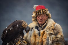 Bayan-Ulgii, Western Mongolia - October 07, 2018: Nomad Games, Golden Eagle Festival. Old Mongolian Nomad-Hunter With Sleeping Gol