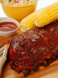 BBQ Ribs With Cole Slaw, Corn And Dipping Sauce Stock Photo
