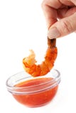 BBQ Shrimp Dipping into Sweet Garlic Chili Sauce stock photography BBQ Shrimp Dipping into Sweet Garlic Chili Sauce stock photography
