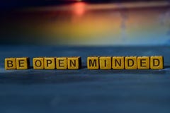 Be open minded on wooden blocks. Cross processed image with bokeh background royalty free stock photography Be open minded on wooden blocks. Cross processed image with bokeh background royalty free stock photography