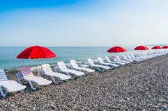 Beach Chairs Or Beds And Sun Red Umbrellas On The Beach Stock Photography Beach Chairs Or Beds And Sun Red Umbrellas On The Beach Stock Photography