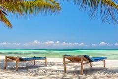 Beach Lounge Chairs Under Palm Tree Leaves At The Shore Of India Stock Images Beach Lounge Chairs Under Palm Tree Leaves At The Shore Of India Stock Images