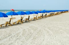 Beach Lounge Chairs With Umbrellas Stock Photography