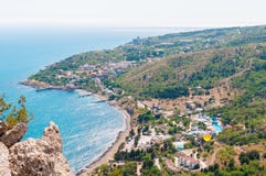 Beach at the seaside, blue water, view from above the mountains to the town of Simeiz, Yalta, Crimea royalty free stock images Beach at the seaside, blue water, view from above the mountains to the town of Simeiz, Yalta, Crimea royalty free stock images