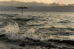 Beach Umbrella In The Lake Ohrid At Stormy Weather Sunset Royalty Free Stock Photos Beach Umbrella In The Lake Ohrid At Stormy Weather Sunset Royalty Free Stock Photos