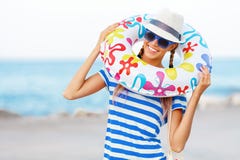 Beach woman happy and colorful wearing sunglasses and beach hat having summer fun during travel holidays vacation Stock Images Beach woman happy and colorful wearing sunglasses and beach hat having summer fun during travel holidays vacation Stock Images