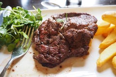 BEEF STEAK WITH VEGETABLE AND FRENCH FRIES DISH royalty free stock photo BEEF STEAK WITH VEGETABLE AND FRENCH FRIES DISH royalty free stock photo
