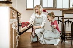 Beaming cheerful mother gently touching her daughter royalty free stock images Beaming cheerful mother gently touching her daughter royalty free stock images