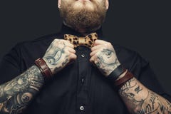 Bearded male with tattooes on his arms. royalty free stock image Bearded male with tattooes on his arms. royalty free stock image