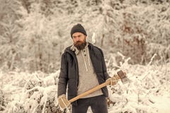 Bearded man lumberjack hold axe in snowy winter forest, camping royalty free stock photography Bearded man lumberjack hold axe in snowy winter forest, camping royalty free stock photography