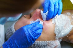 Beautician makes the procedure for cleaning woman face stock photo Beautician makes the procedure for cleaning woman face stock photo