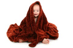 Beautiful 10 Month Old Baby Wrapped In Brown Fuzzy Blanket royalty free stock photography Beautiful 10 Month Old Baby Wrapped In Brown Fuzzy Blanket royalty free stock photography