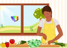 Beautiful African American woman preparing salad