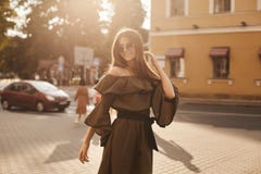 Beautiful And Fashionable Brunette Model Girl In Stylish Dress With Naked Shoulders And In The Trendy Sunglasses Smiles And Posing Royalty Free Stock Image Beautiful And Fashionable Brunette Model Girl In Stylish Dress With Naked Shoulders And In The Trendy Sunglasses Smiles And Posing Royalty Free Stock Image