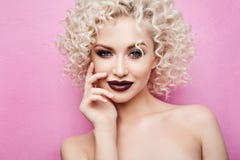 Beautiful And Fashionable Model Girl With Amazing Blue Eyes, With Curly Blonde Hair And With Professional Bright Makeup, Smiles An Stock Photos Beautiful And Fashionable Model Girl With Amazing Blue Eyes, With Curly Blonde Hair And With Professional Bright Makeup, Smiles An Stock Photos