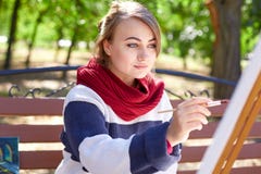 Beautiful artist draws a picture in a good mood outdoors. royalty free stock photo Beautiful artist draws a picture in a good mood outdoors. royalty free stock photo