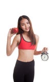 Beautiful Asian healthy girl with clock and apple. Royalty Free Stock Image Beautiful Asian healthy girl with clock and apple. Royalty Free Stock Image