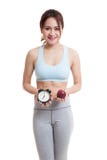 Beautiful Asian healthy girl with clock and apple. Stock Photo Beautiful Asian healthy girl with clock and apple. Stock Photo
