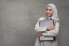Beautiful Asian Muslim Woman Holding Laptop Royalty Free Stock Images