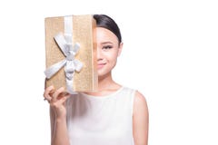 Beautiful Asian woman holding gold gift box on white background Royalty Free Stock Photography Beautiful Asian woman holding gold gift box on white background Royalty Free Stock Photography