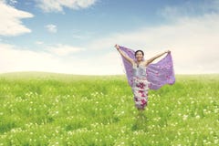 Beautiful asian woman running on field stock images Beautiful asian woman running on field stock images