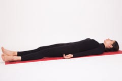 Beautiful athletic girl in black suit doing yoga asanas. Isolated on white background. stock image Beautiful athletic girl in black suit doing yoga asanas. Isolated on white background. stock image