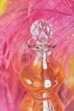 Beautiful background with purple feather and bottle of perfumed stock photos Beautiful background with purple feather and bottle of perfumed stock photos