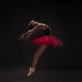 Beautiful ballet dancer on black