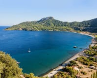 Beautiful bay with turquoise waters, sandy beach surrounded with royalty free stock image Beautiful bay with turquoise waters, sandy beach surrounded with royalty free stock image