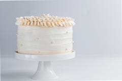 Beautiful Birthday Cake decorate with edible pearls on white neutral background. Copy space. Celebration concept. Trendy Layer Cak royalty free stock photography Beautiful Birthday Cake decorate with edible pearls on white neutral background. Copy space. Celebration concept. Trendy Layer Cak royalty free stock photography