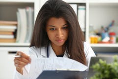 Beautiful black smiling female doctor hold Royalty Free Stock Photos Beautiful black smiling female doctor hold Royalty Free Stock Photos