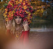 Beautiful blond nymph wearing impressive, colorful coronet stock photo Beautiful blond nymph wearing impressive, colorful coronet stock photo