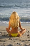 Beautiful Blond Sitting On The Beach Stock Photo